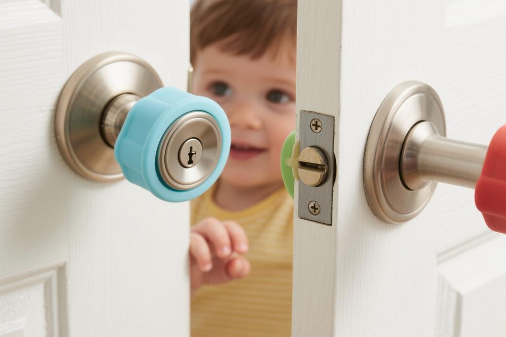 Childproof door handle cover Childproof safety cover on a door handle