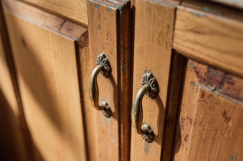 Why do handles discolor over time?